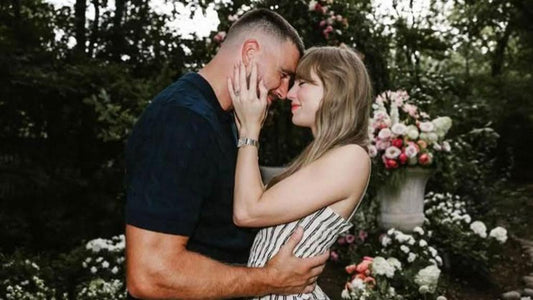 taylor swift and travis kelce announce their engagment on instagram in front of a wall of flowers