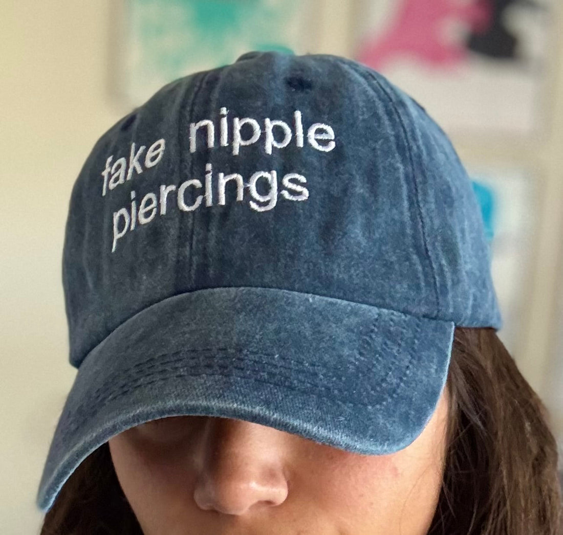 girl wearing nikkys nips fake nipple piercings hat