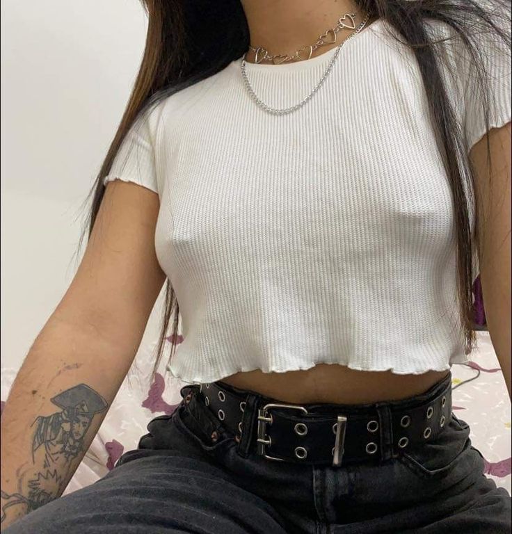 Woman wearing white tee shirt and Nikkys Nips pierced pasties intimate fashion accessories
