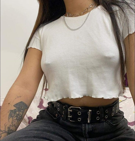 Woman wearing white tee shirt and Nikkys Nips pierced pasties intimate fashion accessories