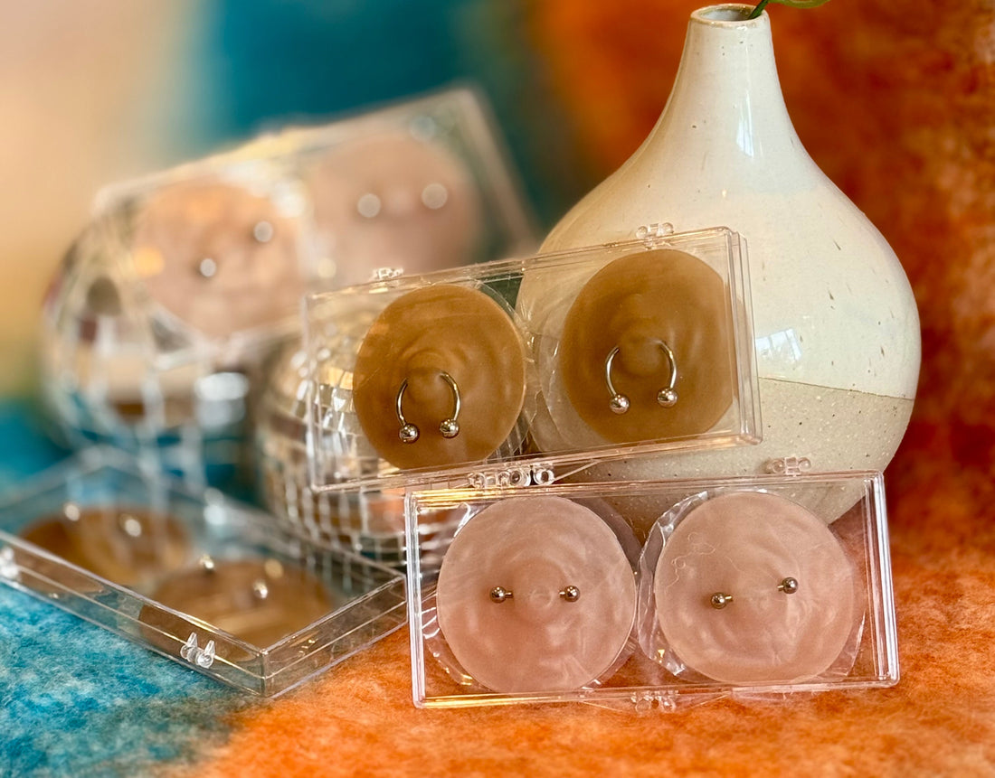 image showing collection of nikkys nips nipple pasties over a blue and orange background. 